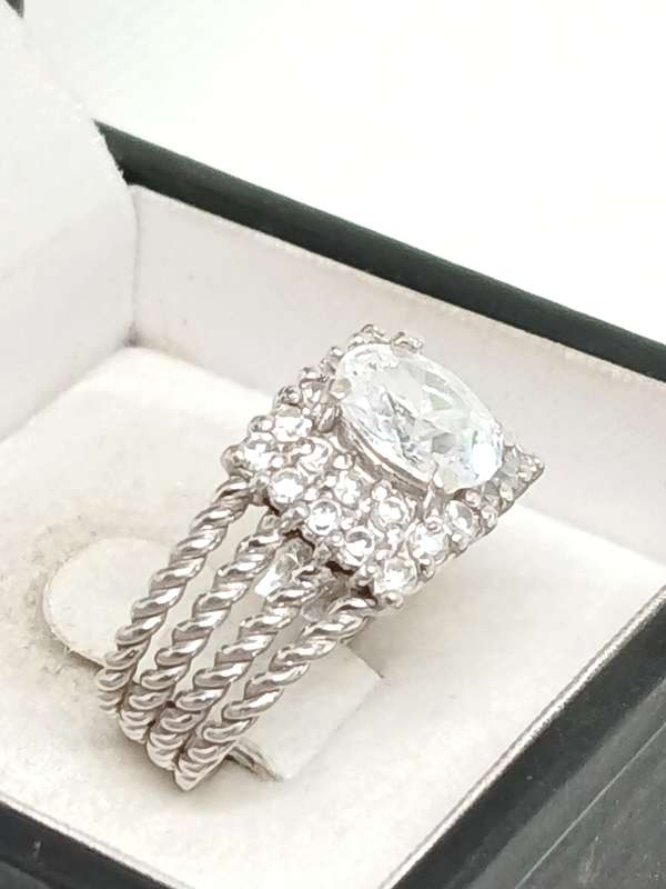 Sterling silver twist ring with cubic stones