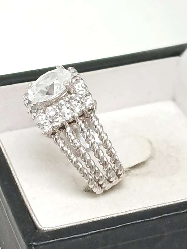 Sterling silver twist ring with cubic stones
