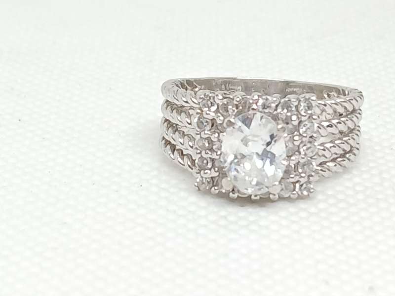 Sterling silver twist ring with cubic stones
