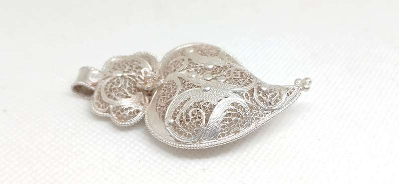 Sterling silver pendant with filigree design