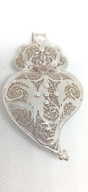 Sterling silver pendant with filigree design