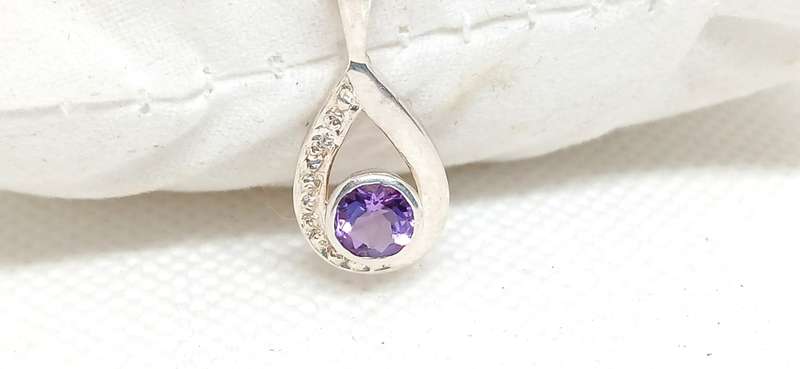 Sterling silver pendant with purple stone