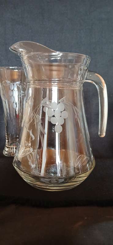 Vintage pitcher and glasses with etched grapes