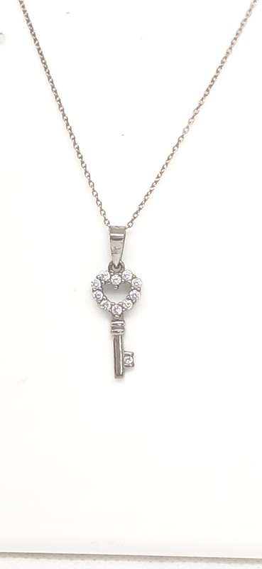 Sterling silver key pendant with cubic stone