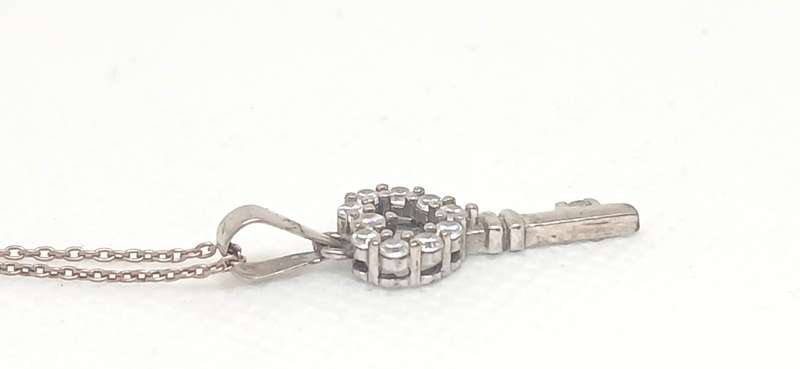 Sterling silver key pendant with cubic stone