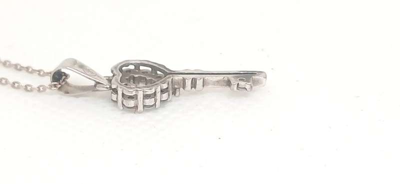 Sterling silver key pendant with cubic stone