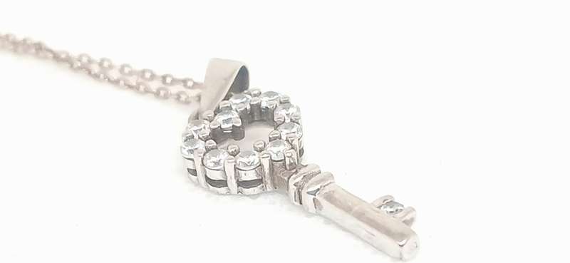 Sterling silver key pendant with cubic stone