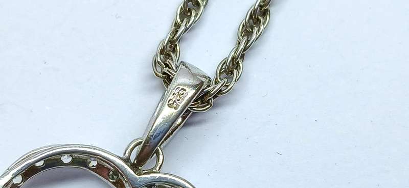 Sterling silver "rose' pendant on chain