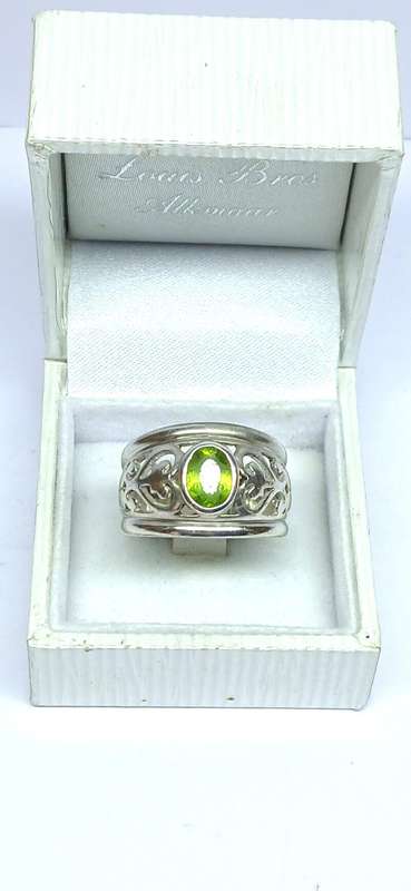 Sterling silver broad ring with green stone