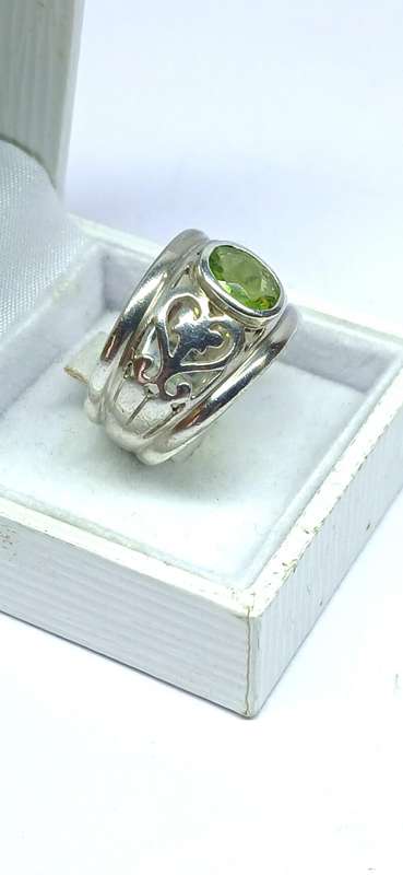 Sterling silver broad ring with green stone