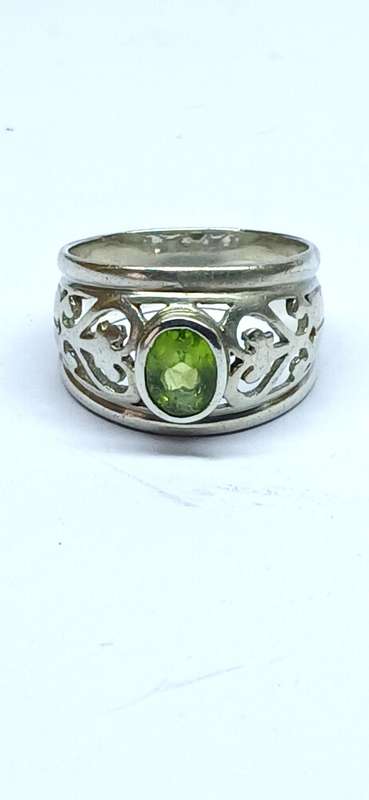 Sterling silver broad ring with green stone