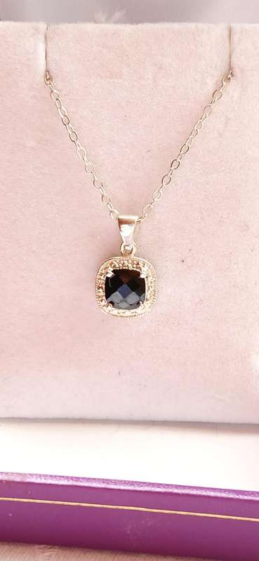 Sterling silver pendant with black stone on chain