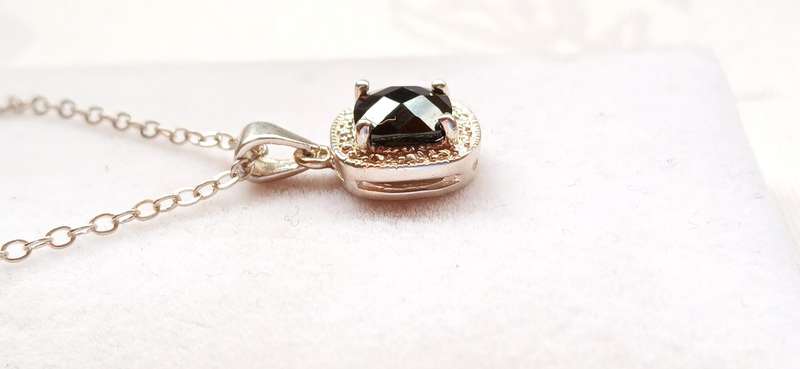 Sterling silver pendant with black stone on chain