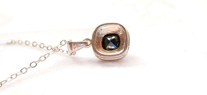 Sterling silver pendant with black stone on chain