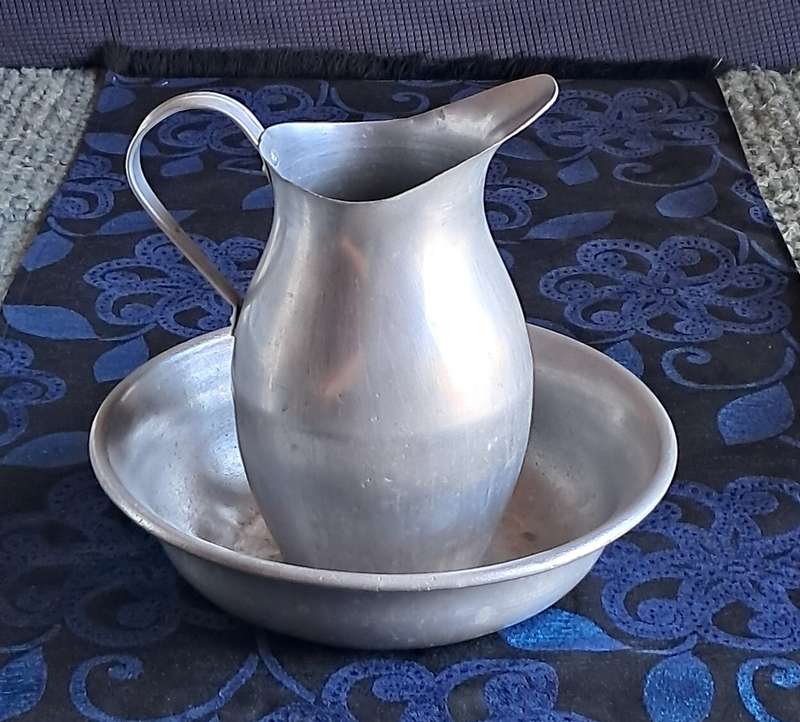 Vintage pewter wash bowl and jug