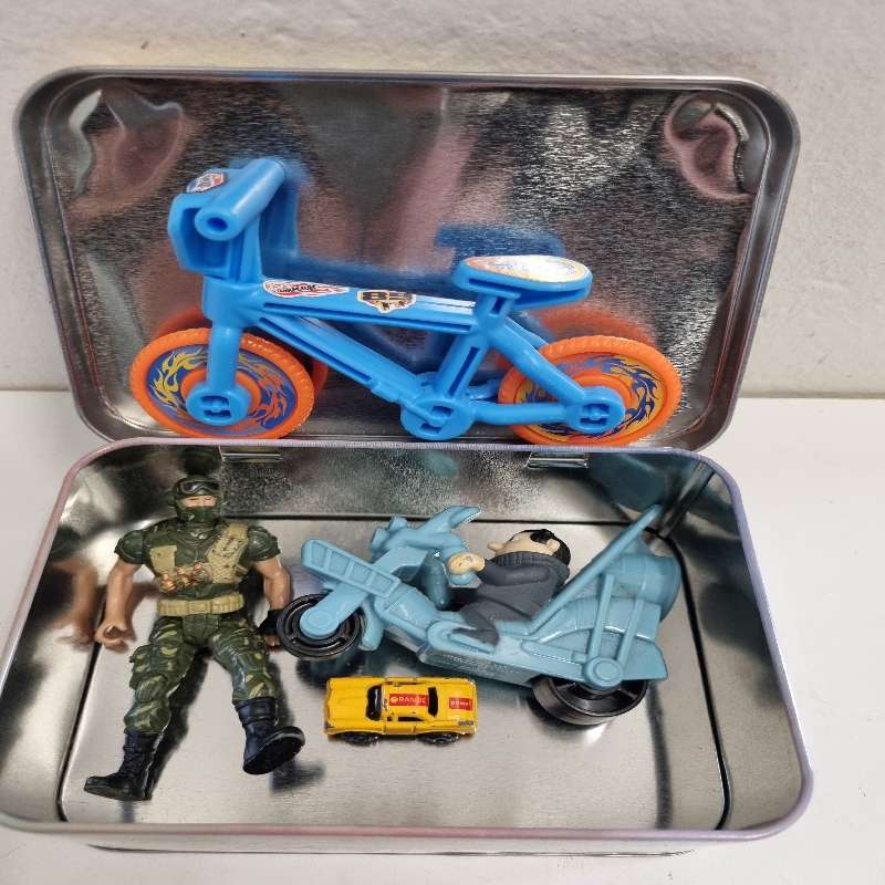 Pokemon Tin with toys including Chap Mei Figurine, Hot Wheel Bike etc.