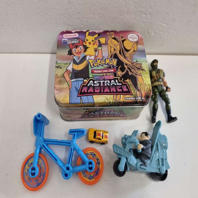 Pokemon Tin with toys including Chap Mei Figurine, Hot Wheel Bike etc.