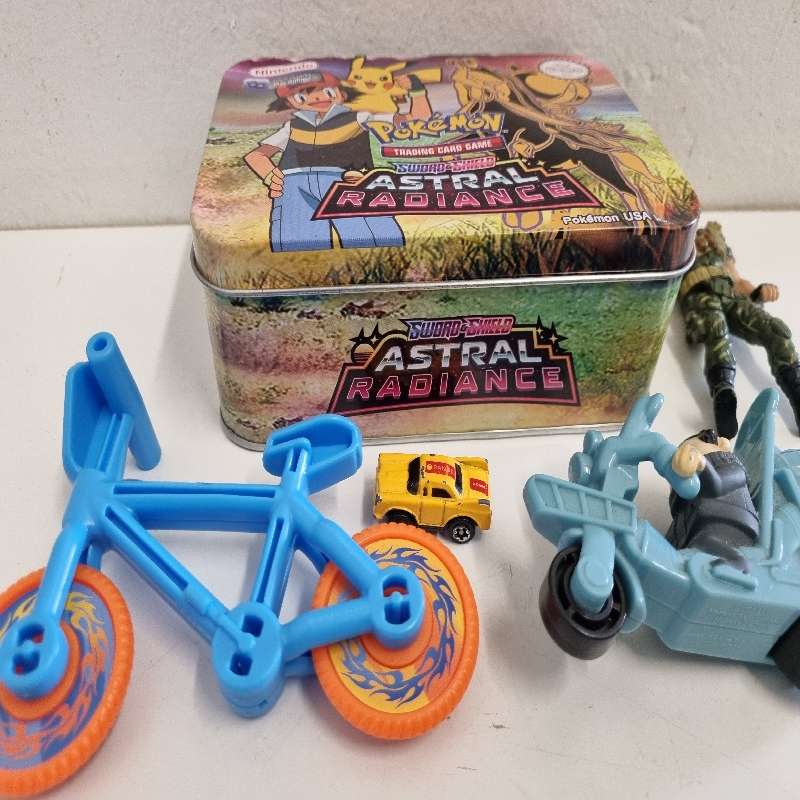Pokemon Tin with toys including Chap Mei Figurine, Hot Wheel Bike etc.