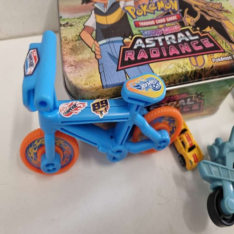 Pokemon Tin with toys including Chap Mei Figurine, Hot Wheel Bike etc.