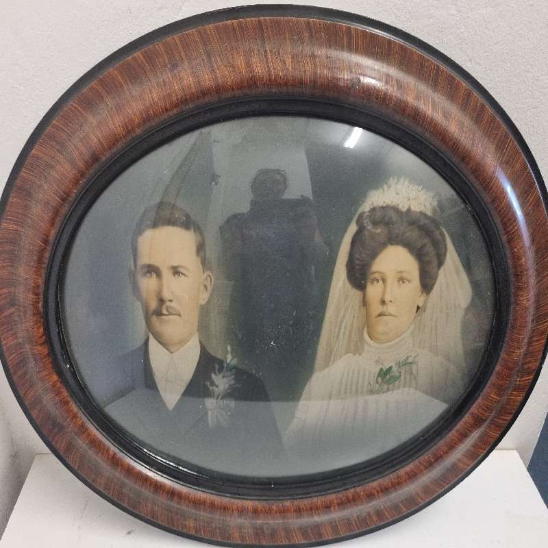 Large Vintage Oval Wooden Picture frame with curved glass and vintage photo