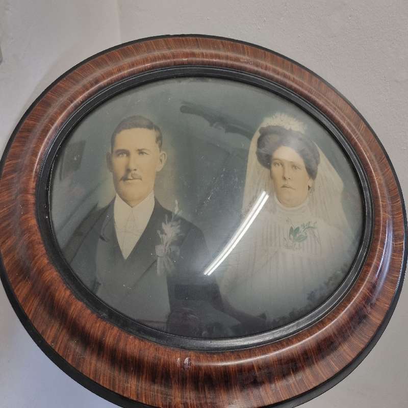 Large Vintage Oval Wooden Picture frame with curved glass and vintage photo