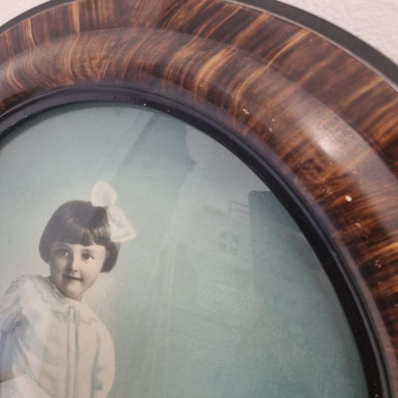 Large Vintage Oval Wooden Picture frame with curved glass and vintage photo
