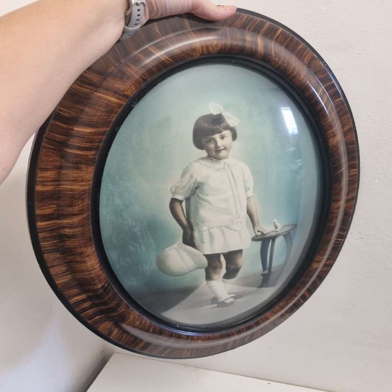 Large Vintage Oval Wooden Picture frame with curved glass and vintage photo