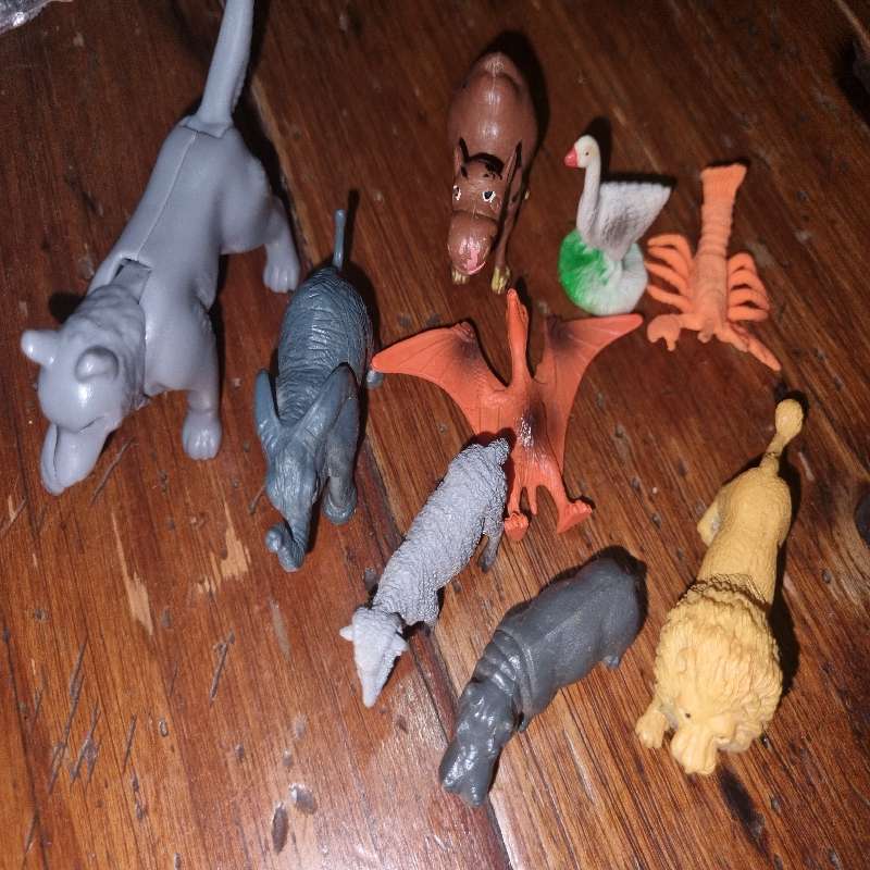Plastic animals including elephant, lion, hippo