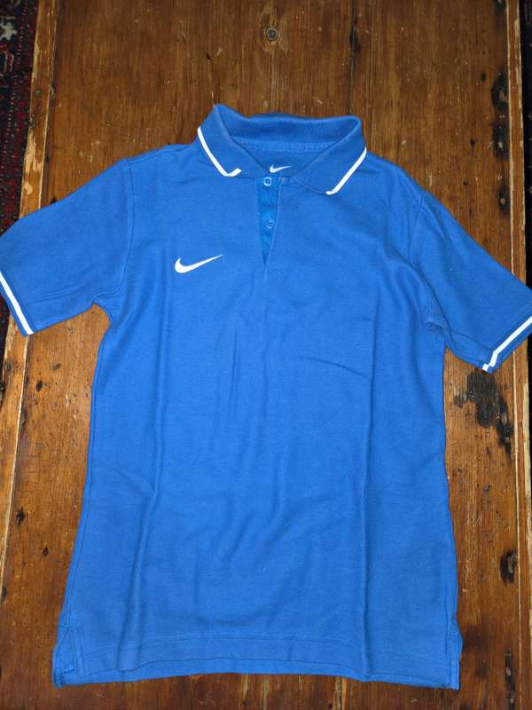 Blue Nike Golf Shirt - Label says M but will better fit an Age 13-14
