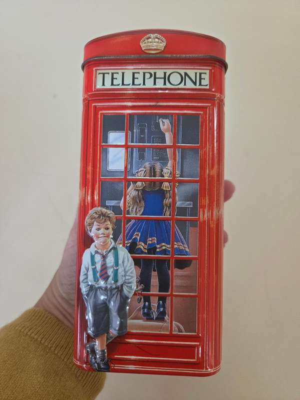 Vintage money box in the shape of an English Phonebooth