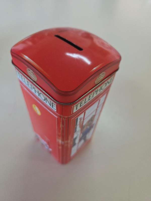 Vintage money box in the shape of an English Phonebooth