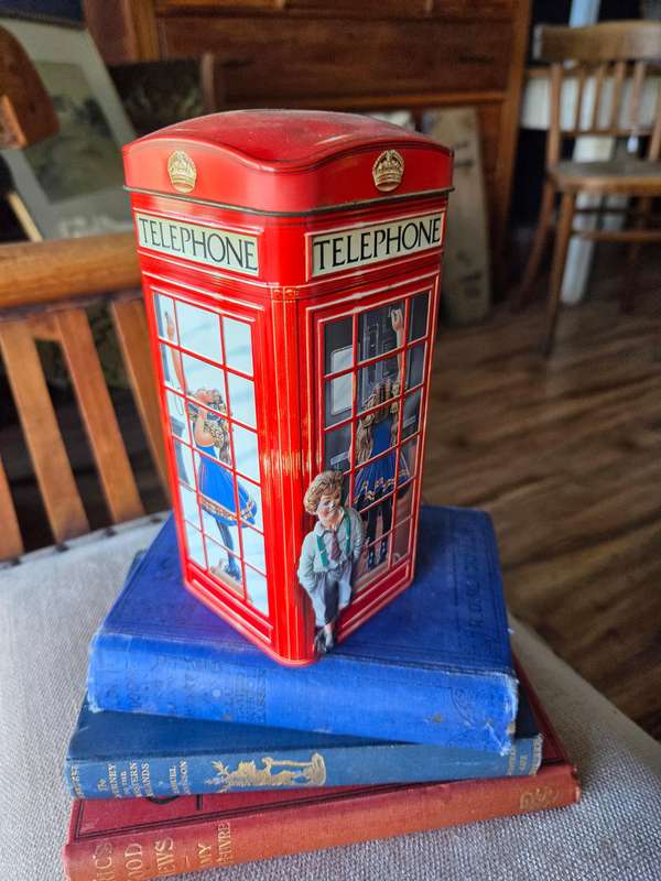 Vintage money box in the shape of an English Phonebooth