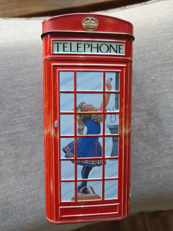 Vintage money box in the shape of an English Phonebooth