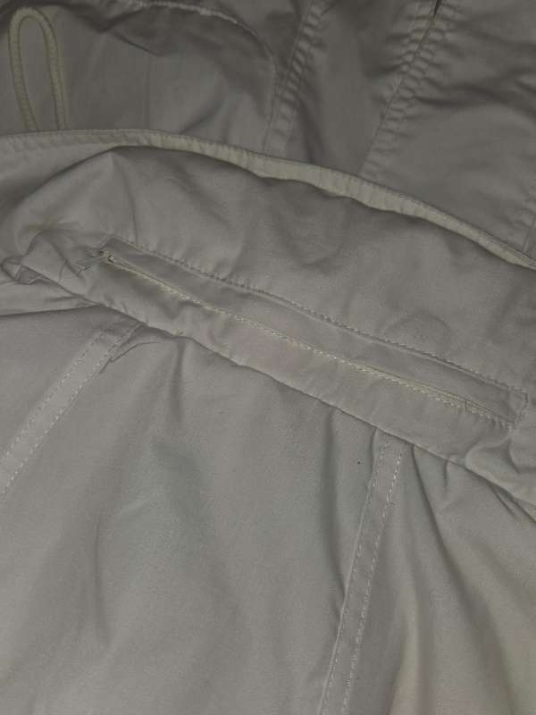 Shelley Jacket with hood that is stored in zipped collar - Size S