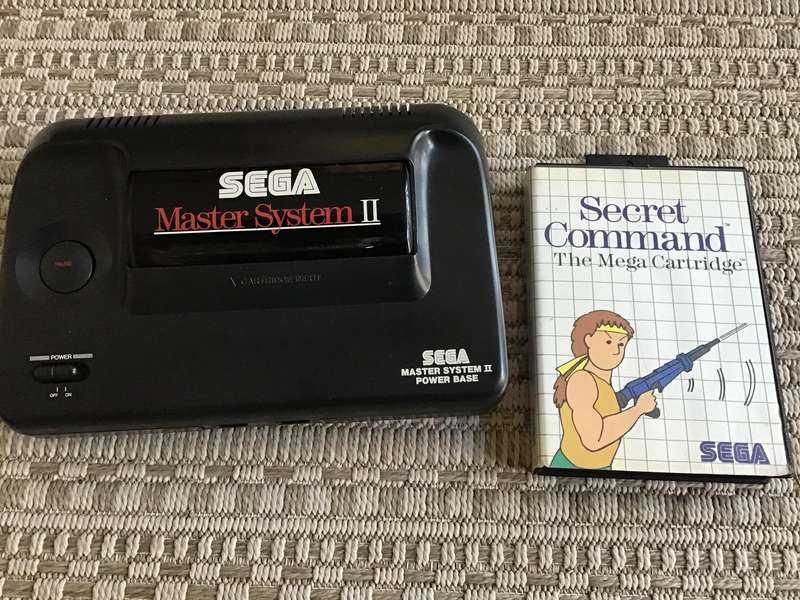 Sega Master System console with game