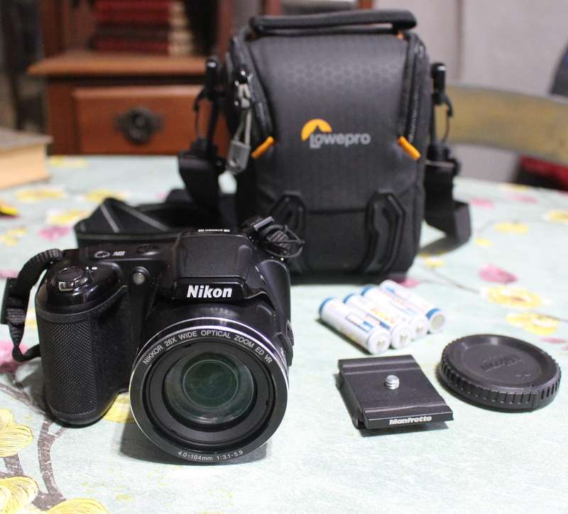 Nikon Coolpix L810 Camera with rechargeable batteries & bag in perfect working condition.