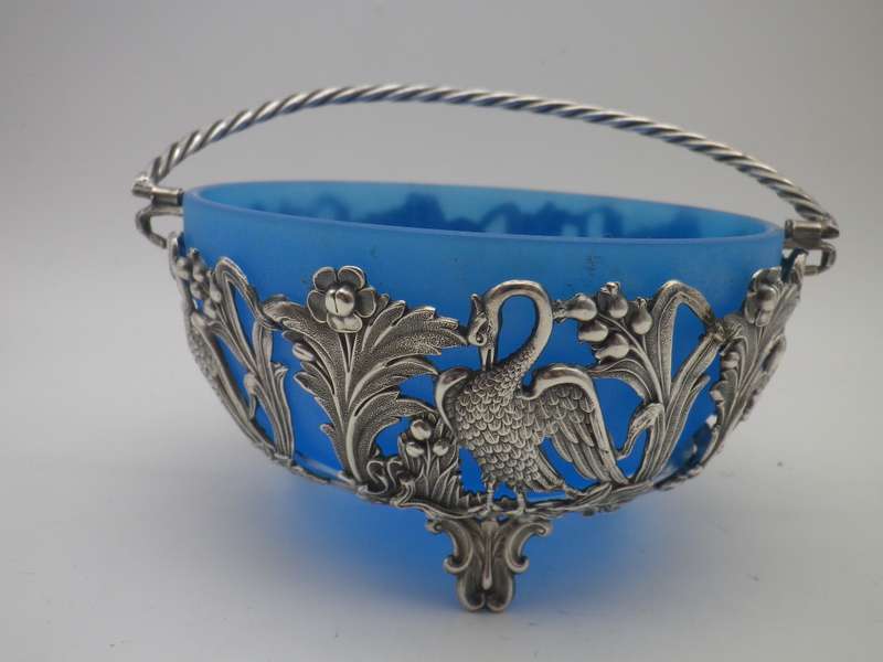 VICTORIAN C1890S SILVER PLATE (or low grade silver?)  ORNATE CRANE BASKET WITH BLUE GLASS LINER.