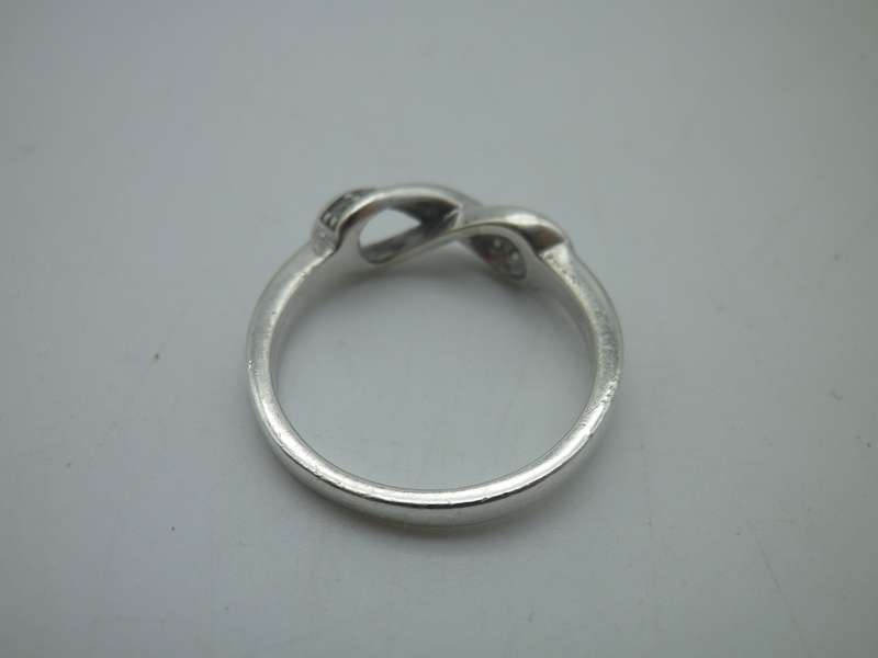 Dainty Sterling Silver INFINITY ring. Set with 10 little cubic zirconias Size: N