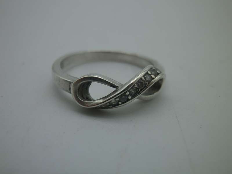 Dainty Sterling Silver INFINITY ring. Set with 10 little cubic zirconias Size: N