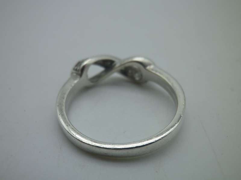Dainty Sterling Silver INFINITY ring. Set with 10 little cubic zirconias Size: N