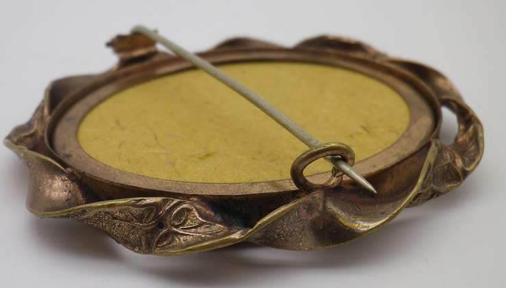 Large Antique Victorian photo memorial brooch with twisted scroll rim. Pinchbeck or gold plated?