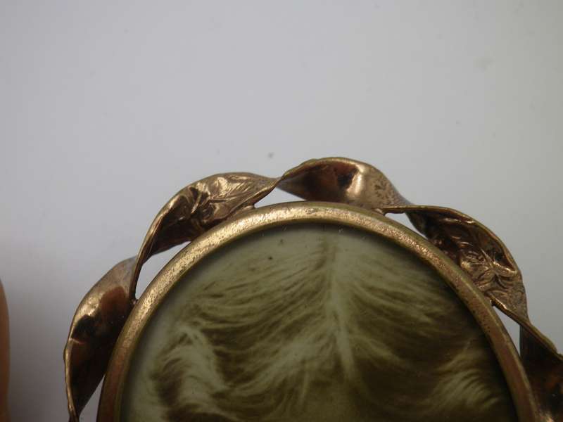 Large Antique Victorian photo memorial brooch with twisted scroll rim. Pinchbeck or gold plated?