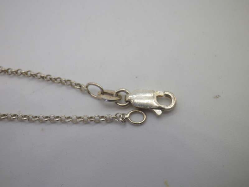 Vintage Sterling Silver CELTIC KNOT PENDANT with a little red stone, on silver Chain