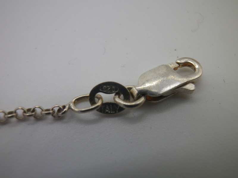 Vintage Sterling Silver CELTIC KNOT PENDANT with a little red stone, on silver Chain