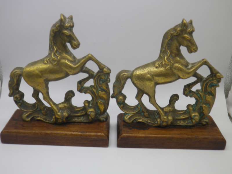 Pair Solid Cast brass Horse bookends on wooden bases. 17.cm x 15cm long