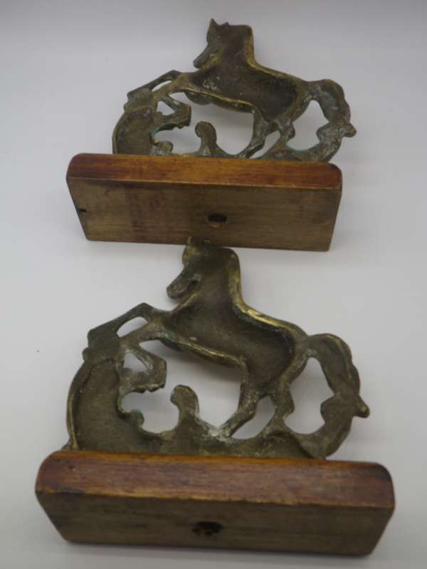 Pair Solid Cast brass Horse bookends on wooden bases. 17.cm x 15cm long