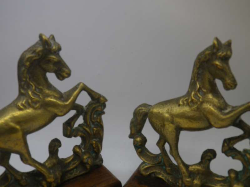 Pair Solid Cast brass Horse bookends on wooden bases. 17.cm x 15cm long
