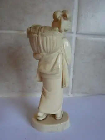 Vintage late 19th Century SIGNED Japanese Carved Okimono of a fruit carrier. 5.5x4 x3cm