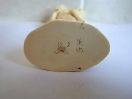 Vintage late 19th Century SIGNED Japanese Carved Okimono of a fruit carrier. 5.5x4 x3cm