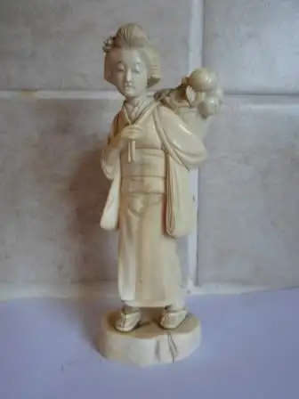 Vintage late 19th Century SIGNED Japanese Carved Okimono of a fruit carrier. 5.5x4 x3cm